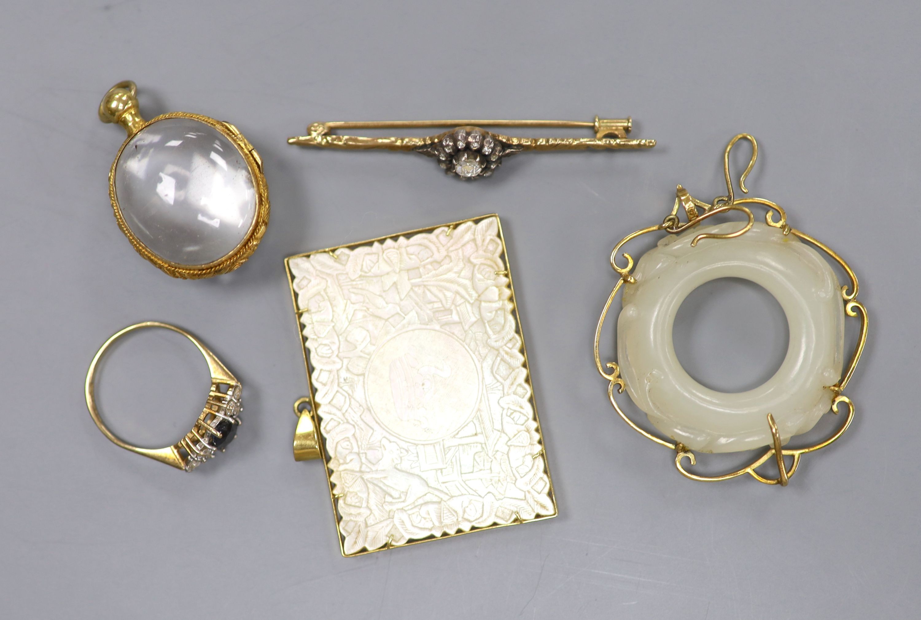 An early to mid 20th century 585 and 925, diamond cluster set bar brooch, 53mm, gross 3.7 grams, a 9ct gem set ring and three mounted pendant including one stamped 14k.